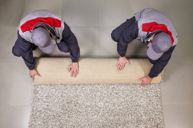 workers-rolling-carpet-floor-home-view-from_130111-2198